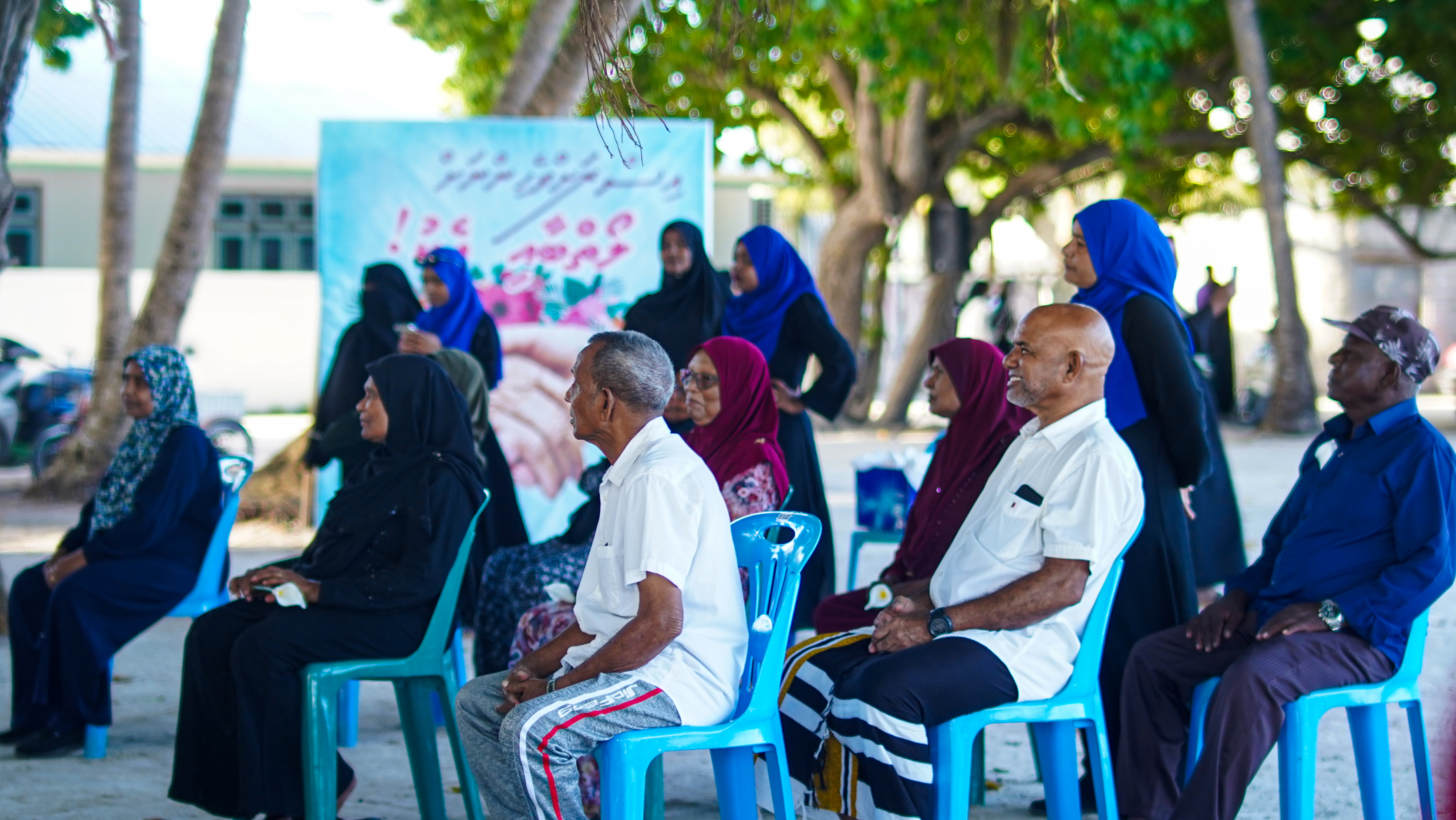 A group of elderly sitting in chairs at K. Huraa