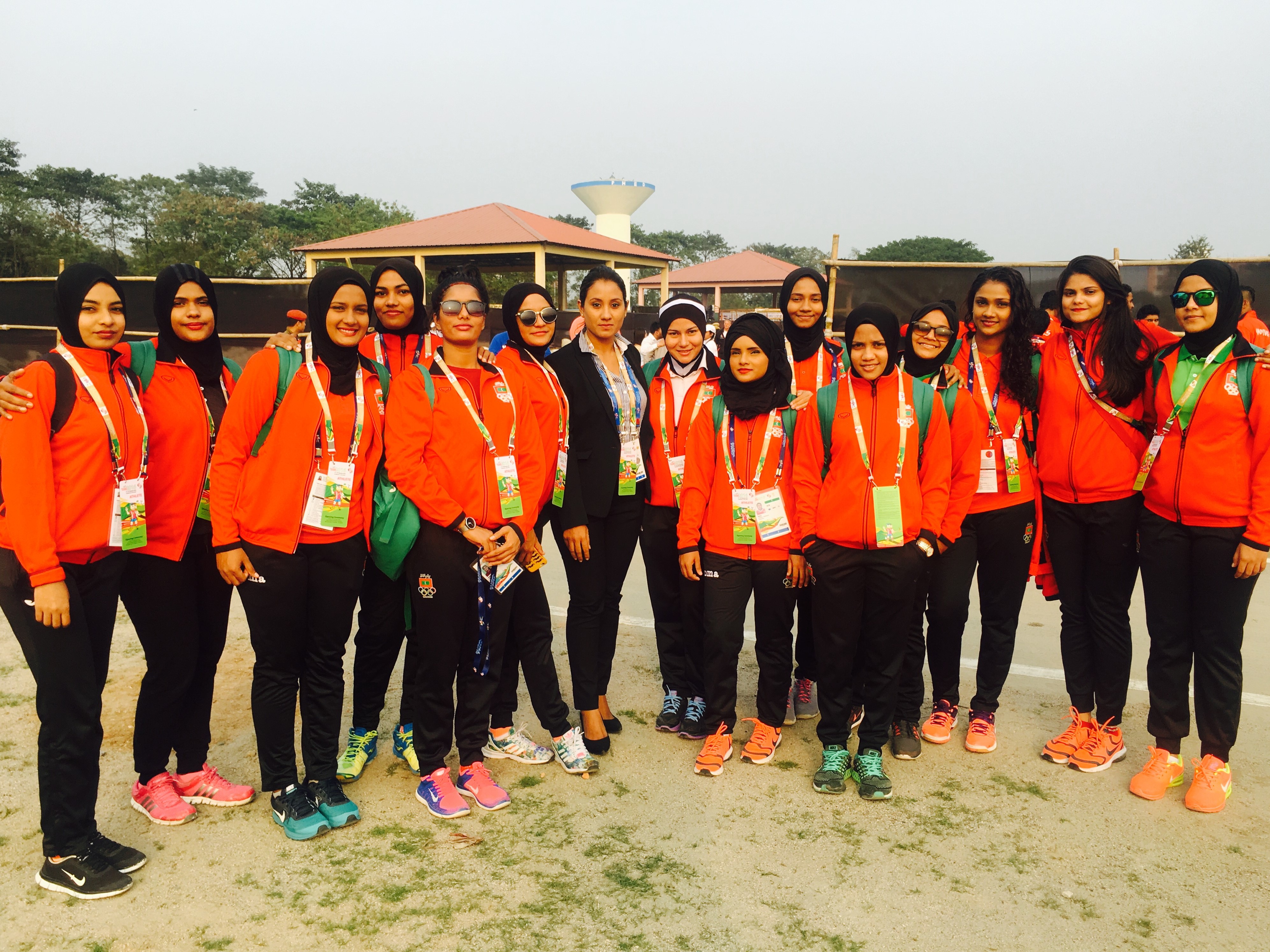 Muna, Deputy Chef De Mission of Maldives Contingent, stands proud with the women's volleyball nation team at 12th South Asian Games 2016. © Muna