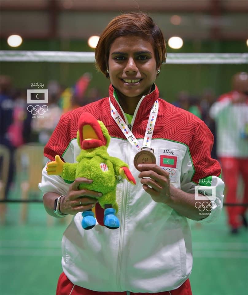 Neela celebrates her victory at the Indian Ocean Island Games in 2019. © Maldives Olympic Committee via Neela