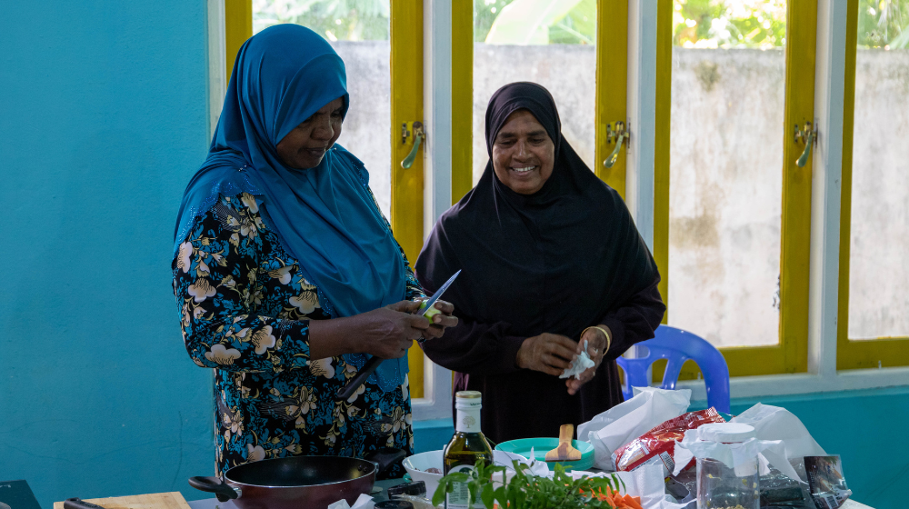 Two women cooking.