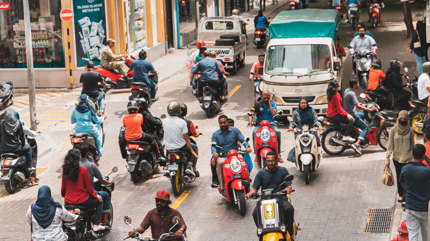 Busy streets of Male' with a lot of vehicles.