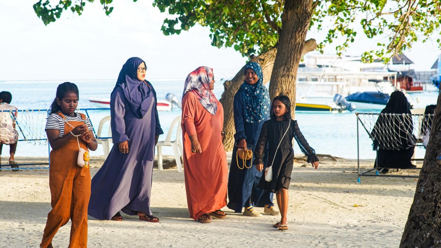 A group of women and girls sharing a joyful moment together 